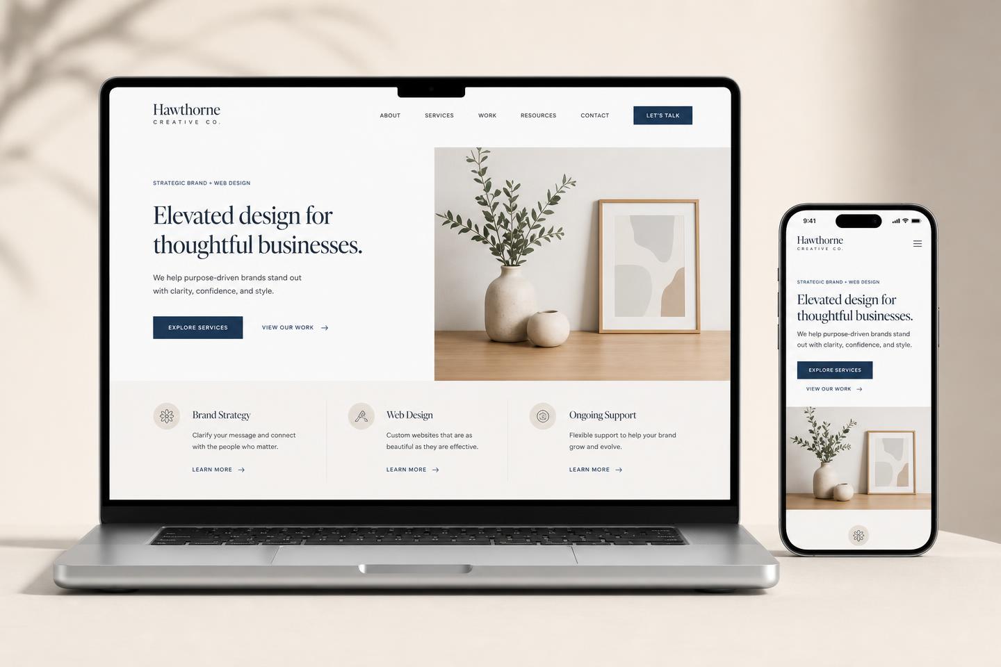 Modern website mockup shown on a laptop and phone
